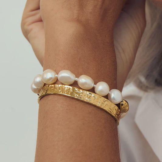Arms of Eva Hariette pearl bracelet